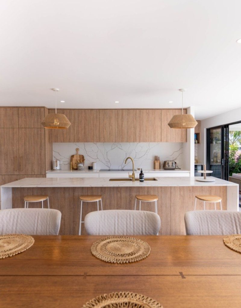 Custom kitchen renovation with marble splashback and timber cabinetry